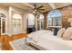 Beautiful bedroom with exposed brick, arched windows, hardwood floors, and built-in display cabinet at 3180 Mathieson Ne Dr # 1401, Atlanta, GA 30305