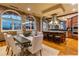 Dining room with dark wood table and seating with arched windows with views of the city at 3180 Mathieson Ne Dr # 1401, Atlanta, GA 30305