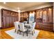 Formal dining room boasting custom wood cabinetry, hardwood floors, and elegant lighting at 3180 Mathieson Ne Dr # 1401, Atlanta, GA 30305
