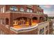 Spacious outdoor patio with brick archways and rooftop access at 3180 Mathieson Ne Dr # 1401, Atlanta, GA 30305