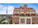 Stunning exterior of a luxury condominium, showcasing its brick facade and multi-level terraces at 3180 Mathieson Ne Dr # 1401, Atlanta, GA 30305