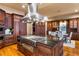 Gourmet kitchen boasts custom cabinets, granite counters, hardwood floors, and stainless appliances at 3180 Mathieson Ne Dr # 1401, Atlanta, GA 30305