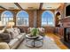 Spacious living area with brick accents and comfortable seating arrangement at 3180 Mathieson Ne Dr # 1401, Atlanta, GA 30305