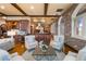 Bright living room featuring hardwood floors with a view of the kitchen and bar area at 3180 Mathieson Ne Dr # 1401, Atlanta, GA 30305