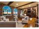Cozy living room with exposed brick, wooden beams, and city views at 3180 Mathieson Ne Dr # 1401, Atlanta, GA 30305