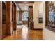 Elegant living room featuring hardwood floors, exposed brick, and a decorative fireplace at 3180 Mathieson Ne Dr # 1401, Atlanta, GA 30305