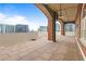 Spacious patio with brick columns, concrete ceiling, and tile floor, offering a scenic city view at 3180 Mathieson Ne Dr # 1401, Atlanta, GA 30305