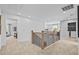 Second floor hallway with carpeted floors and open view of the rooms on the floor at 352 Foxglove Way, Mcdonough, GA 30253