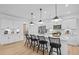 Modern kitchen island with quartz countertops, pendant lighting, and seating for four at 352 Foxglove Way, Mcdonough, GA 30253