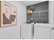 Well-equipped laundry room with modern appliances and minimalist decor at 352 Foxglove Way, Mcdonough, GA 30253