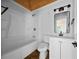 Cozy bathroom with a tub-shower combination, modern lighting, and fixtures with stylish vanity and mirror at 4946 Lake Ridge Trail, Lilburn, GA 30047