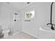 Fresh bathroom design with glass shower, single sink vanity, and modern fixtures at 4946 Lake Ridge Trail, Lilburn, GA 30047