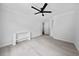 Open bedroom featuring an installed ceiling fan and neutral walls and flooring at 4946 Lake Ridge Trail, Lilburn, GA 30047