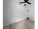 Open bedroom with a doorway into another room and an installed ceiling fan at 4946 Lake Ridge Trail, Lilburn, GA 30047