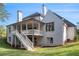 White brick home with a two-story deck and a large backyard at 530 Old Cobblestone Dr, Atlanta, GA 30350