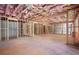 Spacious unfinished basement with exposed insulation and framing for future expansion at 530 Old Cobblestone Dr, Atlanta, GA 30350