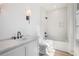 Bright bathroom featuring white vanity, marble countertops, white subway tile, and modern fixtures at 530 Old Cobblestone Dr, Atlanta, GA 30350