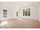 Bright bedroom with hardwood floors, ceiling fan, and large windows providing ample natural light at 530 Old Cobblestone Dr, Atlanta, GA 30350