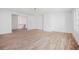 Spacious area with hardwood floors and white walls and a pass-through leading to additional rooms at 530 Old Cobblestone Dr, Atlanta, GA 30350
