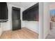 Walk-in closet with black cabinets, drawers, shelving and hardwood flooring at 530 Old Cobblestone Dr, Atlanta, GA 30350