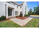 Two-story home with modern front door, manicured lawn and landscaped grounds at 530 Old Cobblestone Dr, Atlanta, GA 30350