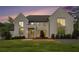 Inviting home exterior with large windows and professional landscaping, showcasing curb appeal and modern design at 530 Old Cobblestone Dr, Atlanta, GA 30350