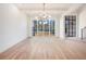 Bright living room featuring modern lighting fixtures, hardwood floors, and large windows at 530 Old Cobblestone Dr, Atlanta, GA 30350