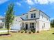 Attractive two-story home with a two-car garage, manicured landscaping, and well-maintained lawn at 62 Sheryl Way, Loganville, GA 30052
