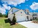 Beautiful two-story home with brick and siding, a two-car garage, and manicured landscaping at 62 Sheryl Way, Loganville, GA 30052