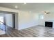 Bright living room featuring a fireplace, neutral walls, wood floors, and recessed lighting at 62 Sheryl Way, Loganville, GA 30052