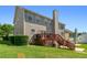 Two-story home with deck, stairs, and grass backyard at 829 Castlebottom Dr, Lawrenceville, GA 30045