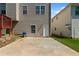 Backyard with patio, grill, and access to home at 829 Castlebottom Dr, Lawrenceville, GA 30045