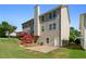Two-story home with deck, stairs, patio and grassy backyard at 829 Castlebottom Dr, Lawrenceville, GA 30045