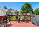 Wood deck with chairs, small table, grill and neighborhood views at 829 Castlebottom Dr, Lawrenceville, GA 30045