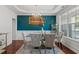 Elegant dining room featuring a glass table, upholstered chairs, and modern chandelier at 829 Castlebottom Dr, Lawrenceville, GA 30045