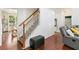 A foyer with wood flooring and a staircase leading to the second floor at 829 Castlebottom Dr, Lawrenceville, GA 30045