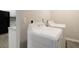 Convenient laundry area featuring modern, white washing machine and dryer at 829 Castlebottom Dr, Lawrenceville, GA 30045