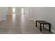 Open and spacious living area with wood-look floors and bright neutral paint at 829 Castlebottom Dr, Lawrenceville, GA 30045