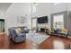 Spacious living room with high ceilings, a fireplace, and large windows for ample natural light at 829 Castlebottom Dr, Lawrenceville, GA 30045