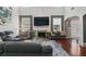 Open living room featuring a fireplace, large windows, and comfortable seating at 829 Castlebottom Dr, Lawrenceville, GA 30045