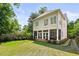 Spacious backyard with patterned driveway and lush greenery, perfect for outdoor activities at 1070 Standard Ne Dr, Brookhaven, GA 30319
