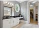 Bathroom vanity leading to a walk-in closet with built in shelving at 1070 Standard Ne Dr, Brookhaven, GA 30319