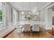 Elegant dining room featuring neutral colors, bright windows, modern lighting and a stylish table setting at 1070 Standard Ne Dr, Brookhaven, GA 30319