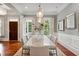 Chic dining room with statement lighting, light walls, and ample seating at 1070 Standard Ne Dr, Brookhaven, GA 30319