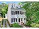 Charming two-story home with white siding, dark shutters, and a lovely front porch at 1070 Standard Ne Dr, Brookhaven, GA 30319