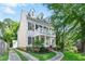 Charming two-story home with a landscaped yard, brick accents, and a double-decker porch with white columns and shutters at 1070 Standard Ne Dr, Brookhaven, GA 30319