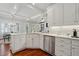 Bright kitchen featuring white cabinets, stainless steel appliances, marble countertops, and hardwood floors at 1070 Standard Ne Dr, Brookhaven, GA 30319