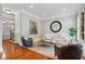 Cozy living room with hardwood floors, natural light, designer furnishings, and artwork at 1070 Standard Ne Dr, Brookhaven, GA 30319