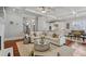 Open-concept living space with hardwood floors, modern furnishings, and access to the kitchen and dining areas at 1070 Standard Ne Dr, Brookhaven, GA 30319