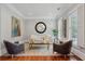 Bright living room with hardwood floors, natural light, designer furnishings, and neutral paint at 1070 Standard Ne Dr, Brookhaven, GA 30319